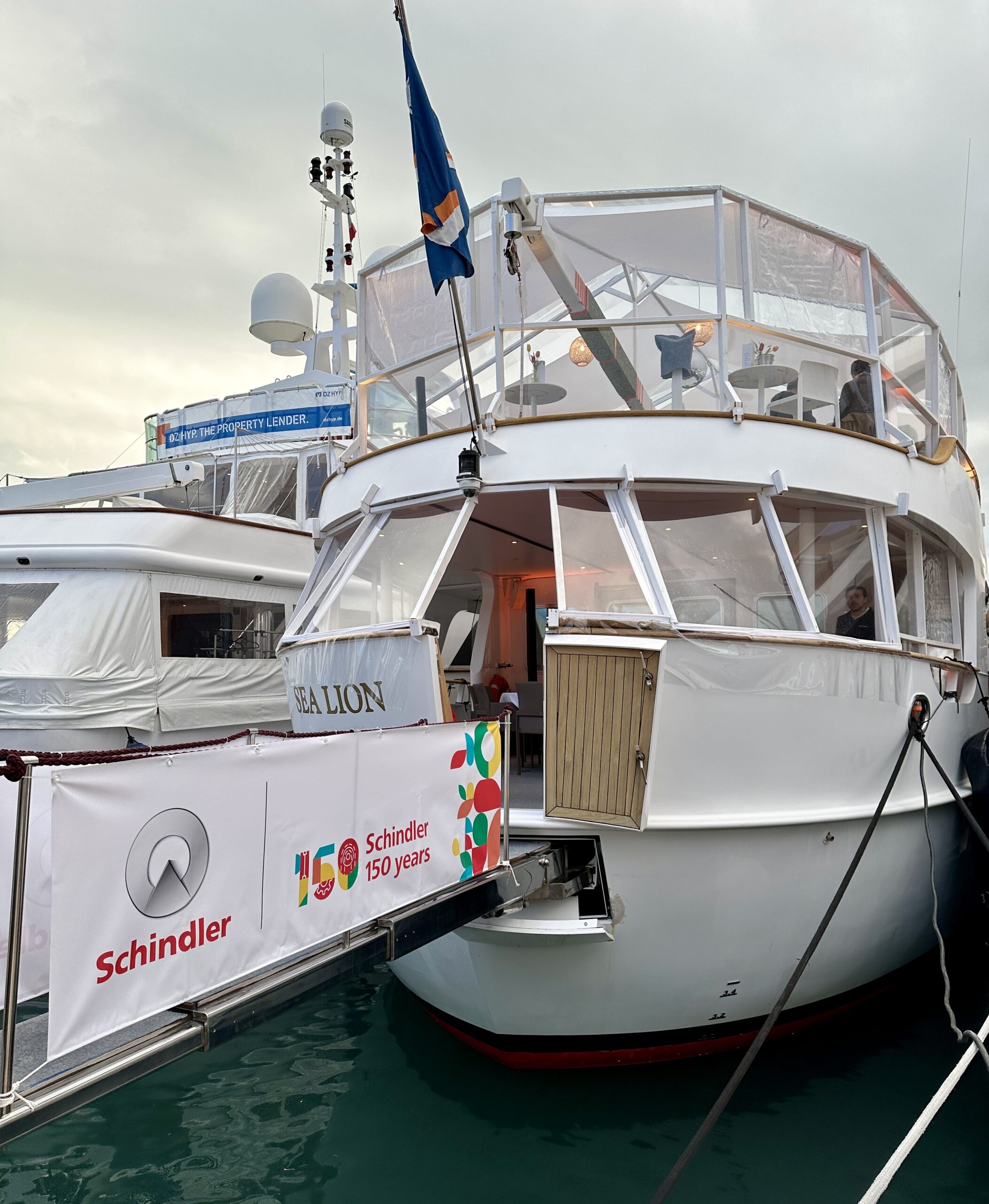 Corporate yacht crew Cannes: aft deck of a yacht moored at the Palais des Festivals during a congress